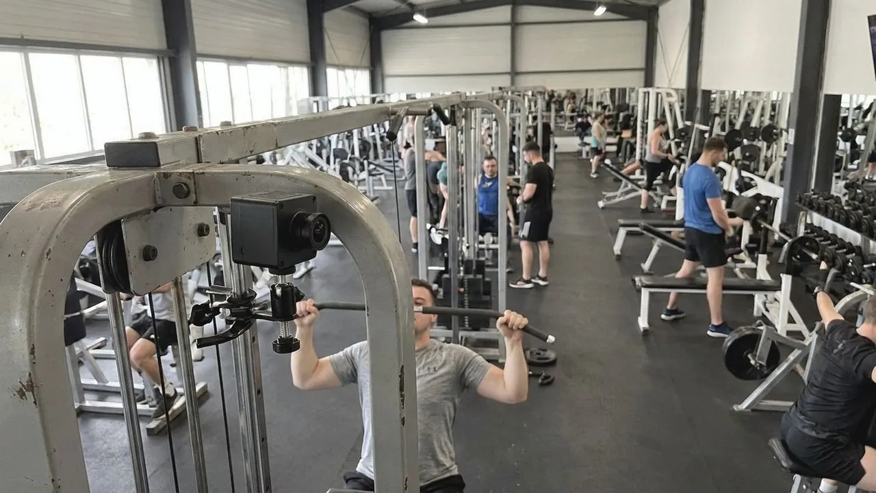 The cable and pulley mechanism of a gym machine.